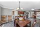 Open dining area with traditional style chairs and rustic wood table set at 2196 Kildare Nw Way, Kennesaw, GA 30152