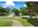 Residential home featuring a well-maintained lawn, mature trees, and a long driveway at 2196 Kildare Nw Way, Kennesaw, GA 30152