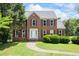 Charming brick home with well-maintained landscaping and a welcoming front entrance at 2196 Kildare Nw Way, Kennesaw, GA 30152