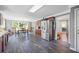 Open kitchen and dining area with dark wood table set and tile floors at 2196 Kildare Nw Way, Kennesaw, GA 30152