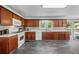 Charming kitchen with wood cabinets, tile flooring, and bright natural light at 2196 Kildare Nw Way, Kennesaw, GA 30152