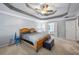 Well-lit main bedroom featuring a cozy bed and a comfortable seating area at 2196 Kildare Nw Way, Kennesaw, GA 30152