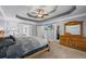 Spacious main bedroom with tray ceiling, ceiling fan, and ample closet space at 2196 Kildare Nw Way, Kennesaw, GA 30152