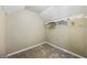 Walk-in closet with painted drywall, basic shelf system, and carpet flooring at 2196 Kildare Nw Way, Kennesaw, GA 30152