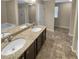 Bathroom featuring double sinks with granite countertops, tile flooring, and bathtub at 265 Edinburgh Ln, Woodstock, GA 30188