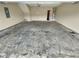 Spacious garage with painted floors, ample room for parking and storage, and good ceiling height at 265 Edinburgh Ln, Woodstock, GA 30188