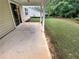 Concrete patio with access to the yard and a view of the house at 265 Edinburgh Ln, Woodstock, GA 30188
