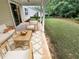 Charming covered patio with cozy seating, ideal for enjoying the outdoors in comfort and style at 265 Edinburgh Ln, Woodstock, GA 30188
