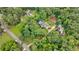 A lush, sprawling property with mature trees, gardens, a pool, and multiple buildings at 280 Blackland Nw Rd, Atlanta, GA 30342