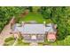 Aerial view of a distinguished brick home with lush landscaping, highlighting its grand scale and setting at 280 Blackland Nw Rd, Atlanta, GA 30342
