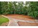 Expansive backyard with mature trees and a winding walkway, creating a serene outdoor space at 280 Blackland Nw Rd, Atlanta, GA 30342
