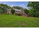 Classic brick home with manicured lawn and mature trees, showcasing timeless curb appeal and elegance at 280 Blackland Nw Rd, Atlanta, GA 30342
