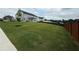 Spacious backyard features a well-maintained lawn and a partial view of the home's exterior at 3378 English Elm Way, Loganville, GA 30052
