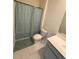 Full bathroom features a shower, toilet, vanity, and modern finishes at 3378 English Elm Way, Loganville, GA 30052