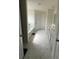 Full bathroom featuring a tub, double sink vanity and modern tile flooring at 3378 English Elm Way, Loganville, GA 30052