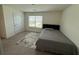 Bedroom featuring carpeted floors, ample lighting and neutral decor at 3378 English Elm Way, Loganville, GA 30052
