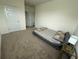 Comfortable bedroom features carpet, a table lamp and neutral colors at 3378 English Elm Way, Loganville, GA 30052