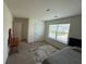 Inviting bedroom with carpeted floors, large window offering plenty of natural light, and neutral decor at 3378 English Elm Way, Loganville, GA 30052