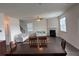 Spacious living room features a fireplace, ceiling fan, and hardwood floors at 3378 English Elm Way, Loganville, GA 30052