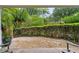 Secluded backyard with gravel, wooden fence, and lush greenery at 812 Dixie Ne Ave, Atlanta, GA 30307