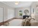 Relaxing bedroom with hardwood floors, soft lighting, and a view of the backyard at 812 Dixie Ne Ave, Atlanta, GA 30307