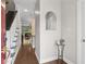 Inviting foyer featuring hardwood floors, stairs, and an arched mirror for added elegance at 812 Dixie Ne Ave, Atlanta, GA 30307