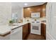 Modern kitchen with wooden cabinets, stainless steel appliances, and sleek countertops at 812 Dixie Ne Ave, Atlanta, GA 30307
