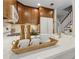 This kitchen has dark wood cabinets, with a breakfast bar over looking the living room at 812 Dixie Ne Ave, Atlanta, GA 30307