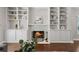 Bright living room with built-in shelves, fireplace, and hardwood floors provides a cozy atmosphere at 812 Dixie Ne Ave, Atlanta, GA 30307