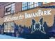 Colorful mural saying 'Welcome to Inman Park' on the side of a brick building at 812 Dixie Ne Ave, Atlanta, GA 30307