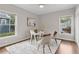 Cozy office with two windows, white desk, hardwood floors, and neutral decor at 812 Dixie Ne Ave, Atlanta, GA 30307