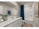 Bright bathroom with a large vanity, framed mirror, framed art, and a tub with shower at 1209 Arnhem Dr, Hampton, GA 30228