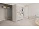 Well-lit bedroom with a dresser, open closet, and view through the open doorway at 1209 Arnhem Dr, Hampton, GA 30228