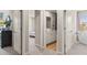 Hallway offering views into the rooms, featuring doorways and white trim at 1209 Arnhem Dr, Hampton, GA 30228