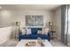 Comfortable living room showcasing a blue sofa, bicycle artwork and stylish lamps at 1209 Arnhem Dr, Hampton, GA 30228