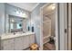 This bathroom offers a vanity with sink, walk-in shower with curtain, and neutral gray walls at 2165 Shillings Chase Nw Dr, Kennesaw, GA 30152