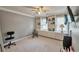 This large bedroom provides a built-in bookcase, ceiling fan, carpet, and neutral walls at 2165 Shillings Chase Nw Dr, Kennesaw, GA 30152
