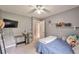This bedroom provides neutral colors, soft carpet, and built in shelves for storage or decor at 2165 Shillings Chase Nw Dr, Kennesaw, GA 30152