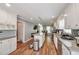 Bright kitchen showcasing stainless steel appliances, a center island with seating, and ample white cabinetry at 2165 Shillings Chase Nw Dr, Kennesaw, GA 30152