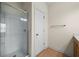 Bathroom featuring a tiled shower with a glass door and tile flooring at 262 Bell Grove Ln, Suwanee, GA 30024