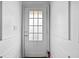 Clean, white door with multi-pane window and white trim at 262 Bell Grove Ln, Suwanee, GA 30024