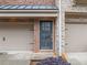 Exterior view of front door and two-car garage at 262 Bell Grove Ln, Suwanee, GA 30024