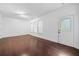 Bright living room features wood-look flooring and natural light at 262 Bell Grove Ln, Suwanee, GA 30024