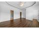 Spacious primary bedroom features hardwood floors, tray ceiling, walk-in closet, and ensuite bathroom at 262 Bell Grove Ln, Suwanee, GA 30024