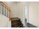Stairway with wood stairs, white risers, and wood banister at 262 Bell Grove Ln, Suwanee, GA 30024
