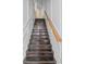 Stairway with wood stairs, white risers, and wood banister at 262 Bell Grove Ln, Suwanee, GA 30024
