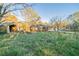 An exterior shot of a single-story home with a large, grassy backyard and shed at 2693 Larkspur Se Dr, Atlanta, GA 30316
