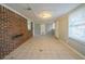 Spacious basement featuring tile floors, brick accent wall, and windows at 2693 Larkspur Se Dr, Atlanta, GA 30316