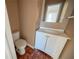 Powder room featuring vanity, mirror, toilet, and vinyl flooring at 2693 Larkspur Se Dr, Atlanta, GA 30316