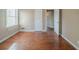 Bedroom with hardwood floors, neutral paint, and natural light from the window at 2693 Larkspur Se Dr, Atlanta, GA 30316